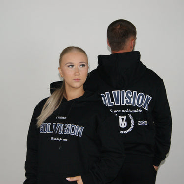 GolVision Original Hoodie Black – premium cotton polyester streetwear
Model wearing GolVision black hoodie – classic streetwear fit
Front view GolVision Original Hoodie Black – minimalist design
GolVision black streetwear hoodie – logo embroidery close-up
